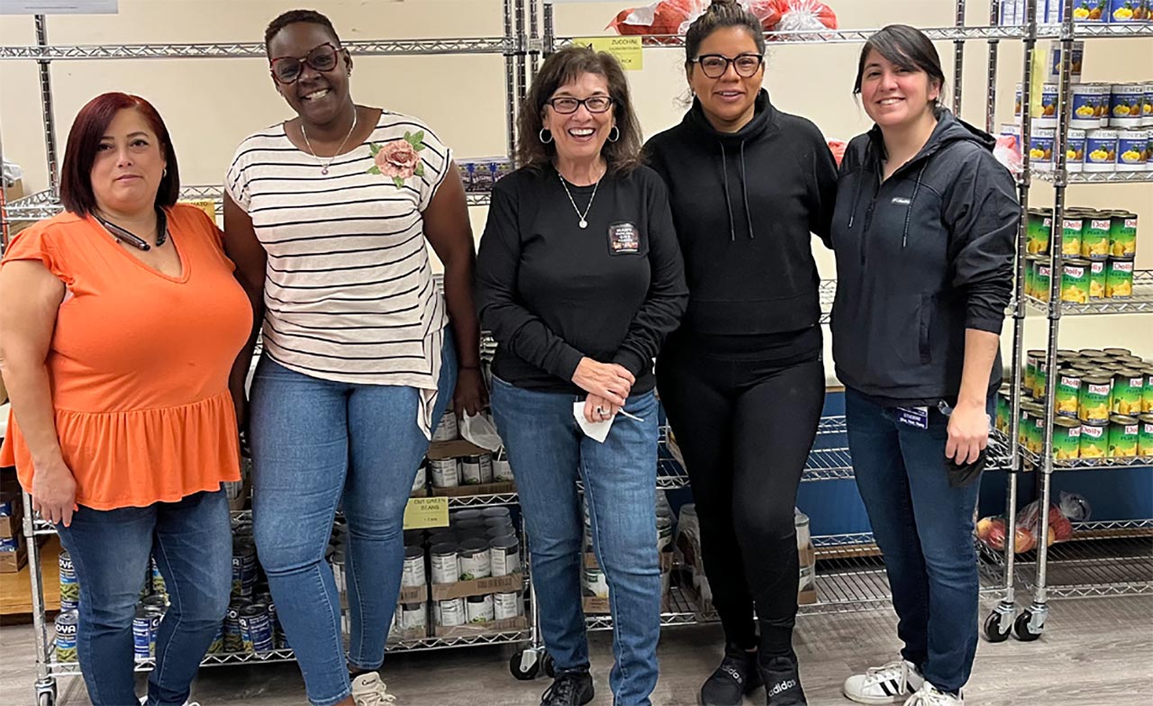 NYSUT Board member Sandra Carner-Shafran, center, helped food bank volunteers at the Capital District Latinos food bank. From left, Carmen Acosta, Santa Nieses, Rebecca Jones and Cynthia Avalos.