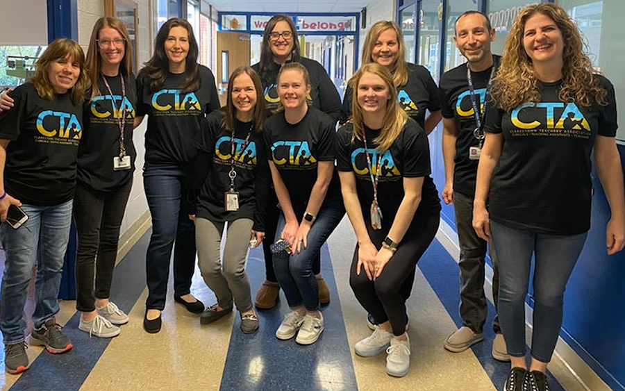 CTA school group smiling together in their t-shirts with logo