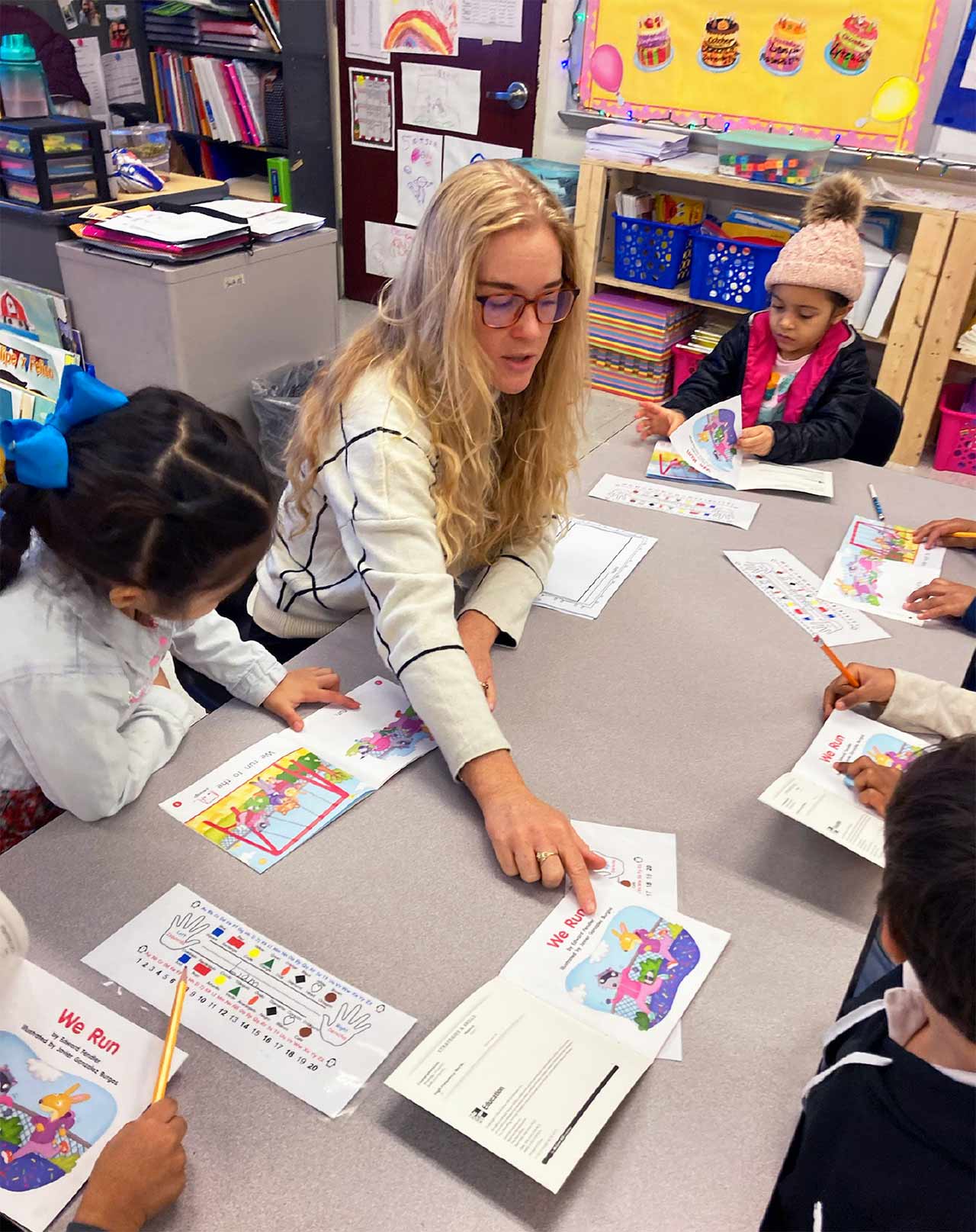 Utica TA member Hannah Smith works with students in one of the district’s bilingual kindergarten classes.