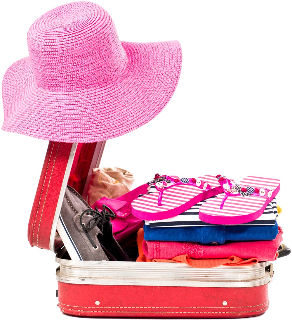 a packed red suitcase with a pink woven hat hanging on the open top