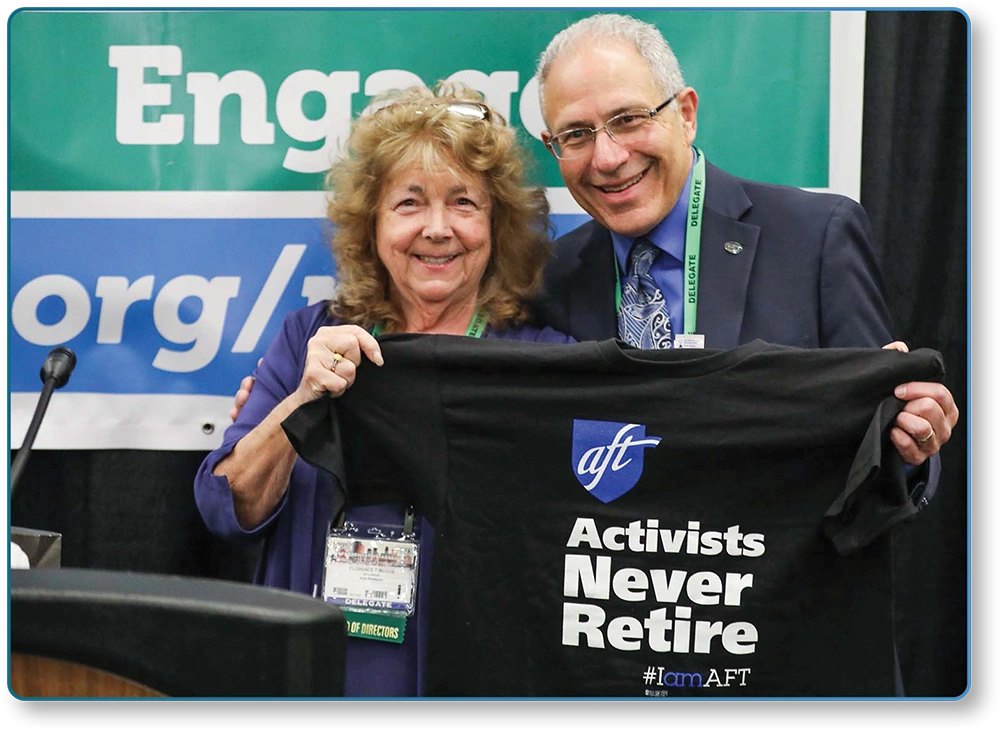 Florence McCue, at-large ED 51-53 director, and NYSUT President Emeritus Andy Pallotta holding "Activists Never Retire" shirt