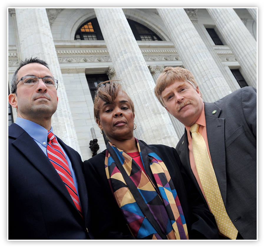 Richard Ognibene, Patricia Jordan, and Jeff Peneston standing on the steps of the State Education Department