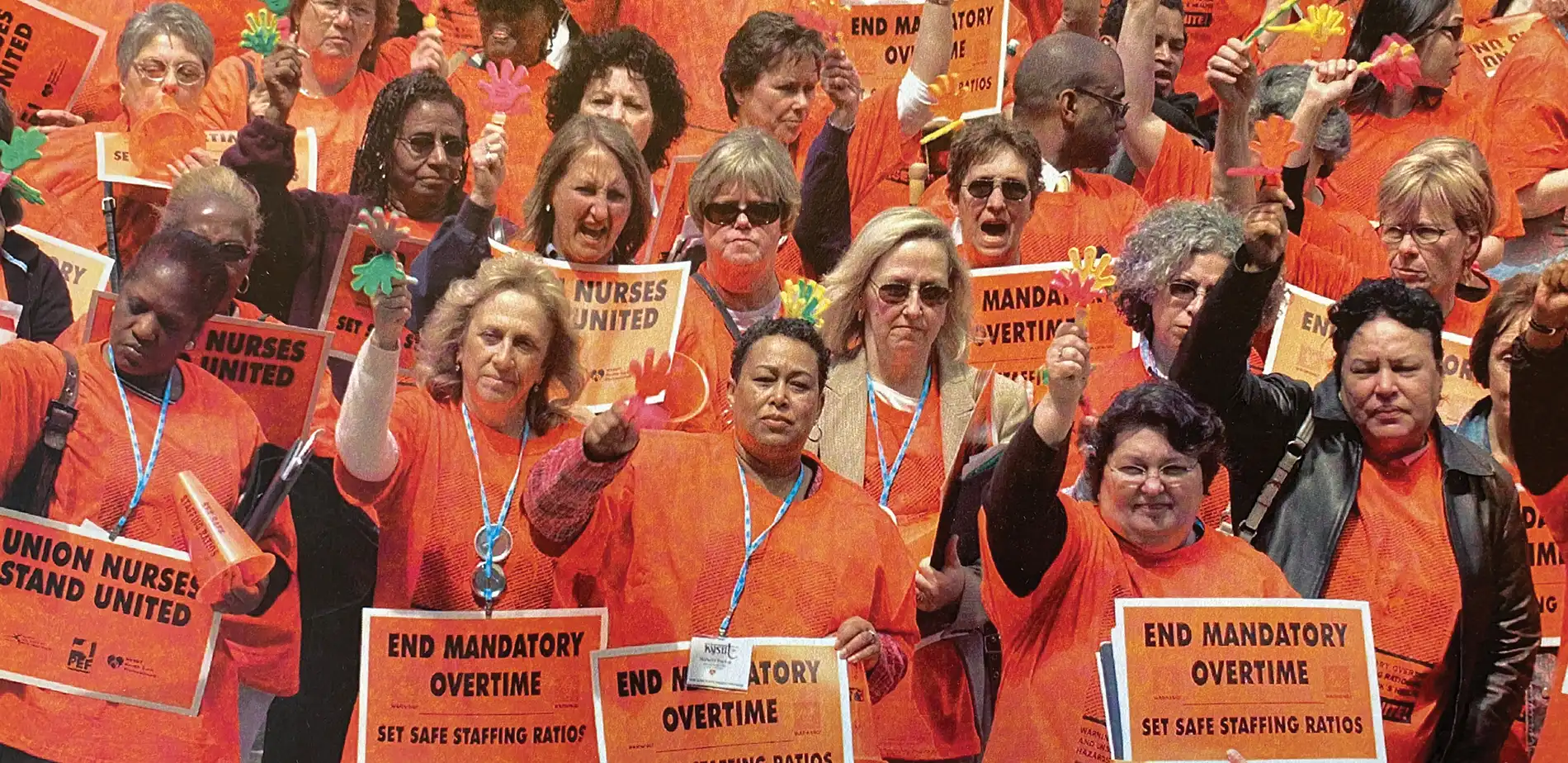 Crowd of Union Nurses in orange at a rally