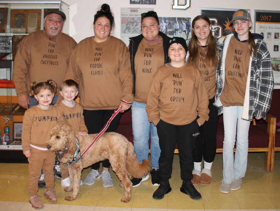 family with brown sweaters for Turkey Raffle Run/Walk