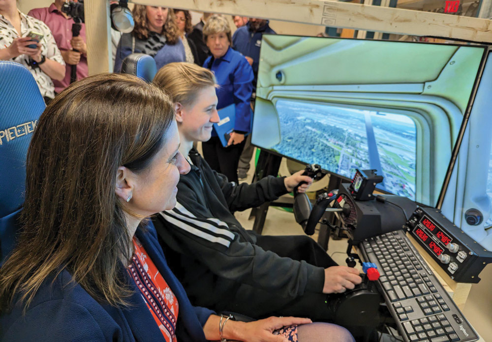 woman using a student-built flight simulator