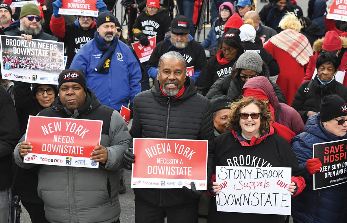 Patrick Romain, J. Philippe Abraham, and Carolyn Kube among the crowd of protestors against the closure of a teaching hospital