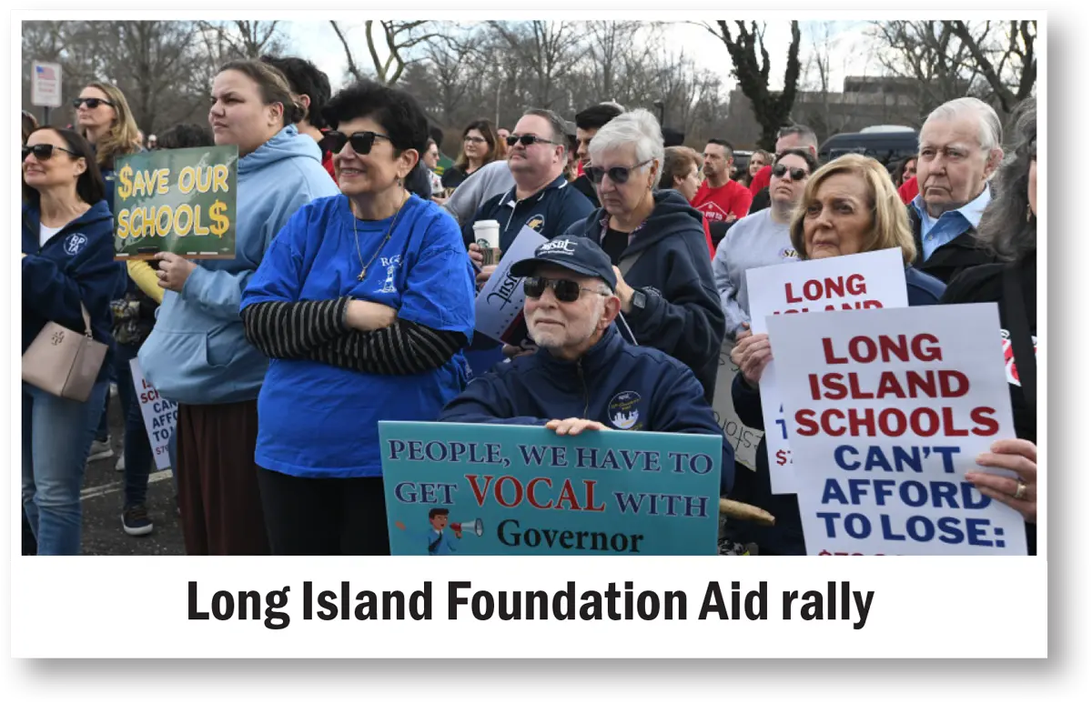 a crowd of attendees hold support signs at the Long Island Foundation Aid rally