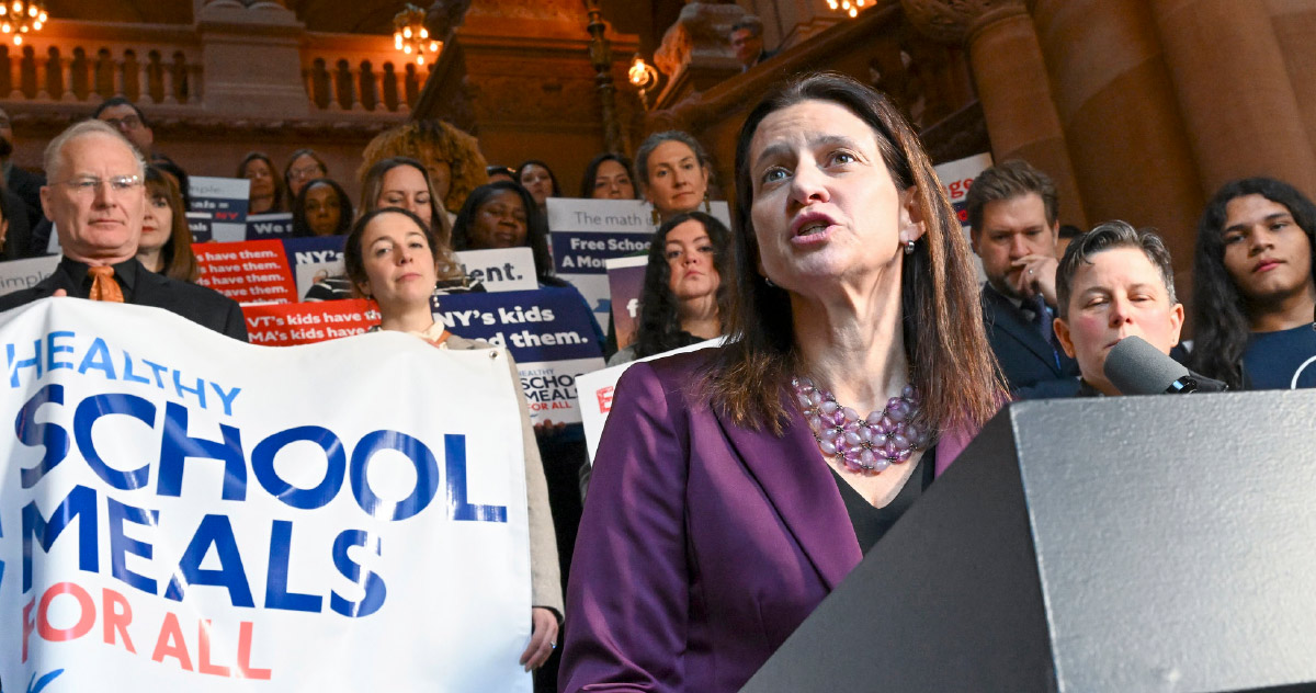 NYSUT President Melinda Person standing at podium while speaking at Healthy School Meals for All Coalition event