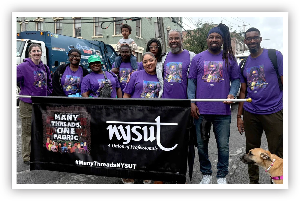 A group of adults and children wearing purple shirts stand behind a banner that reads "MANY THREADS, ONE FABRIC" and "NYSUT: A Union of Professionals". A dog is visible on the right.