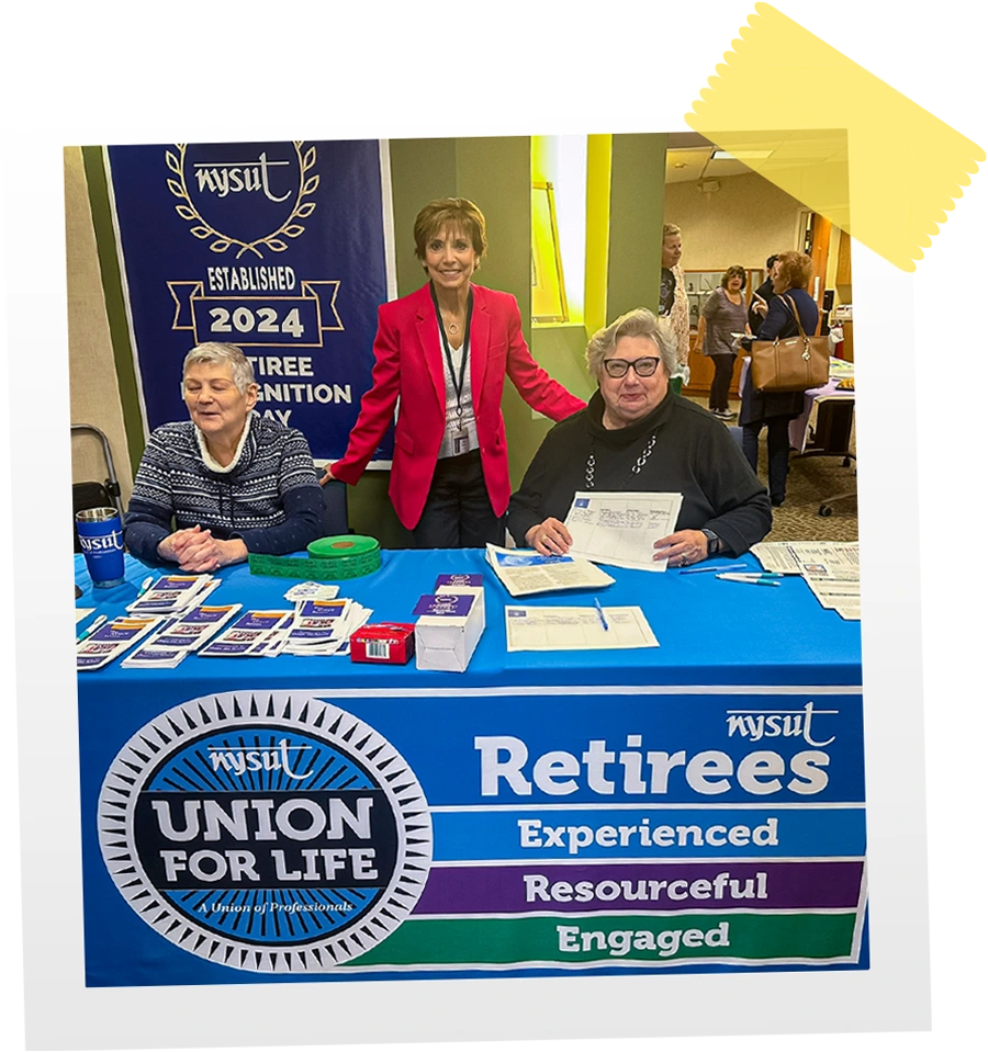 three retirees from Western New York take a group photo while working an NYSUT Retirees information table