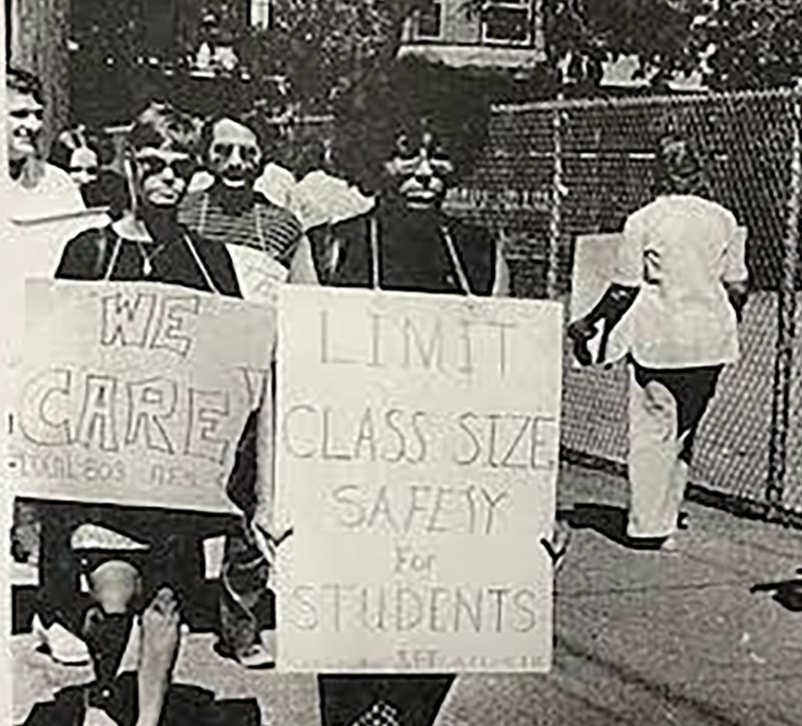 Black and white photo of two Schenectady teachers picketing during the 1975 strike, with signs reading: ‘WE CARE’ and ‘LIMIT CLASS SIZE, SAFETY for STUDENTS.’
