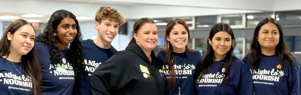 Volunteers for the SHS Nourish Project posing for a group photo during a community service event