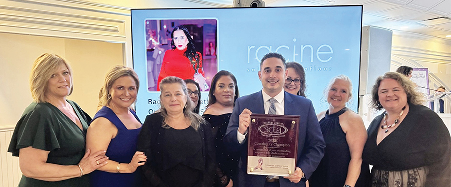 SCTA members smiling for group photo while holding plaque