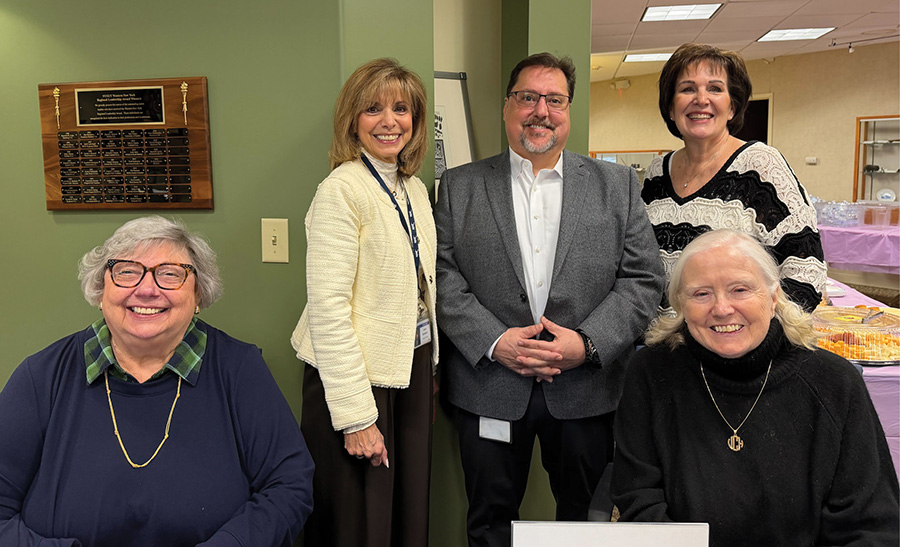 Event organizers Lynn Mele, Janet Goddard, Joe Cantafio, Liz Dloce, and Veronica Cavan smiling together.