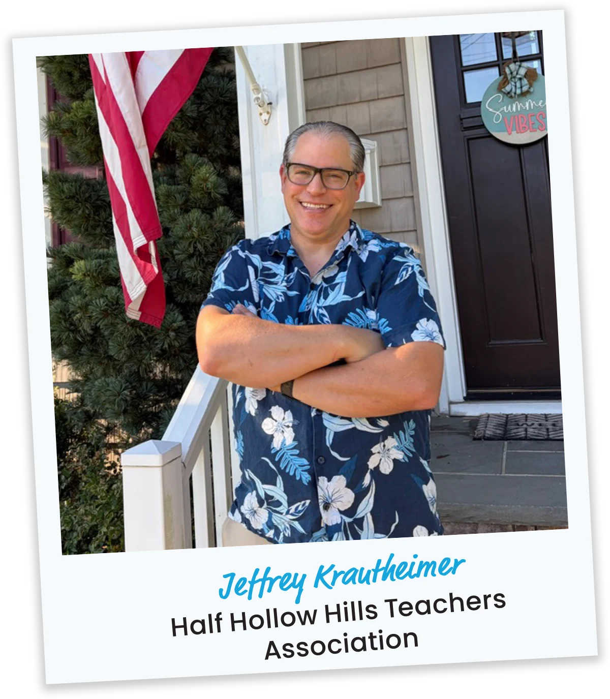 Jeffrey Krautheimer from Half Hollow Hills Teachers Association in a blue floral shirt smiling on a front porch next to an American flag.